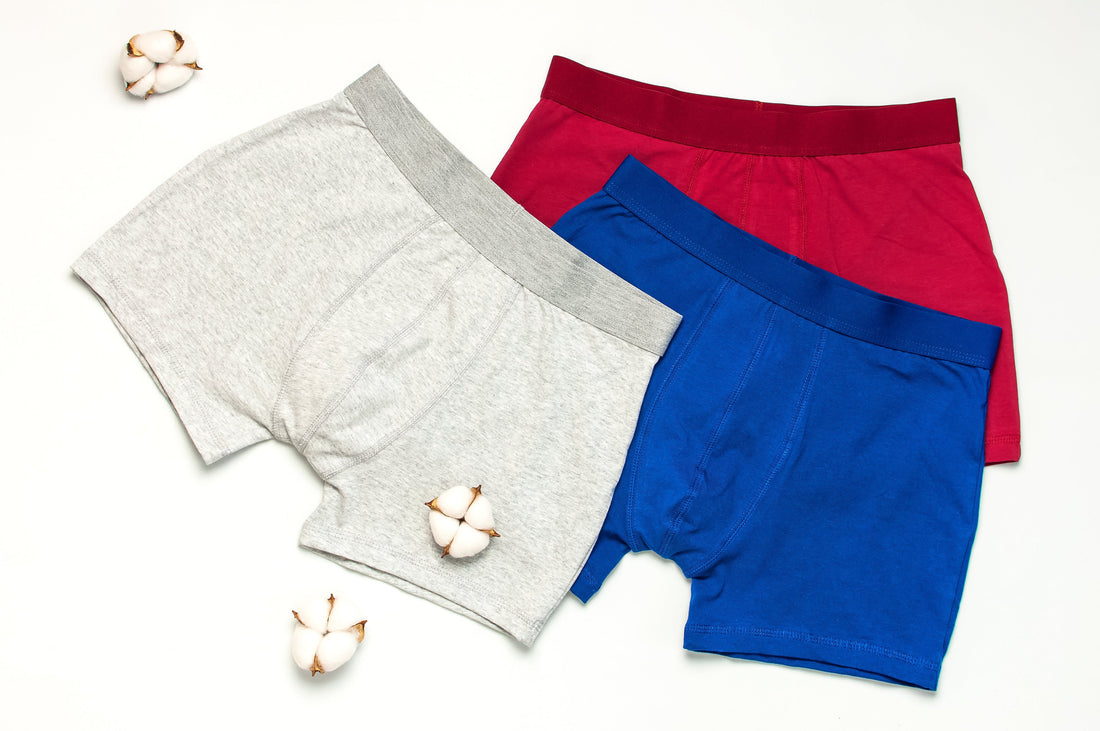 Set of three men's trunks in red, blue, and grey colours